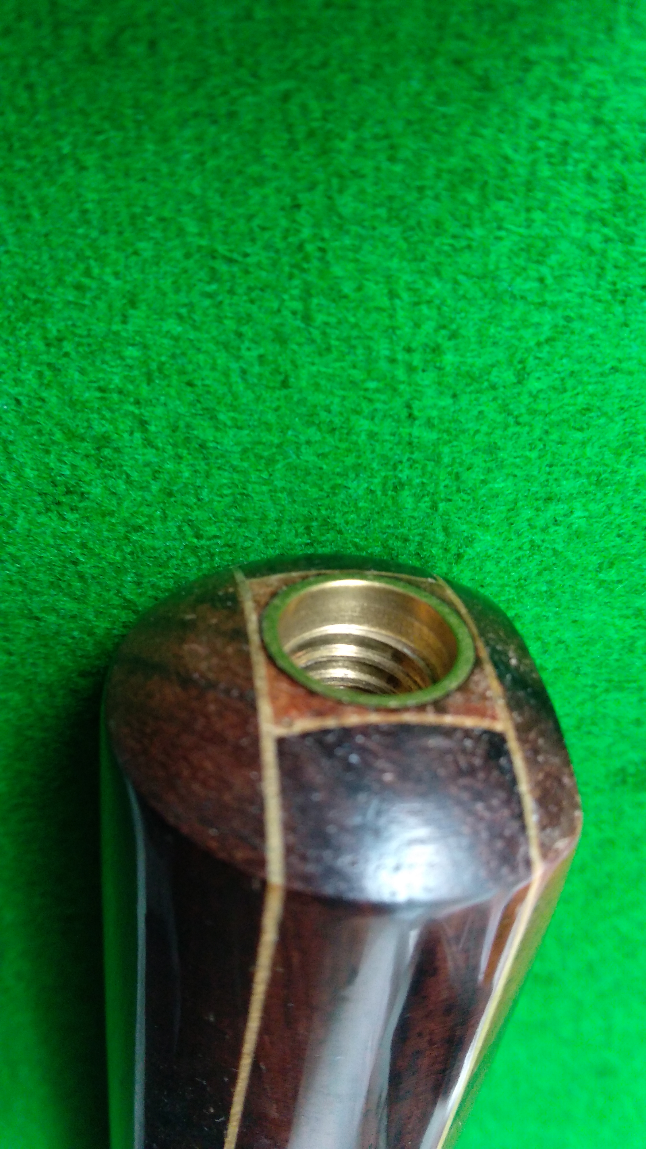 The butt end of a pool cue
