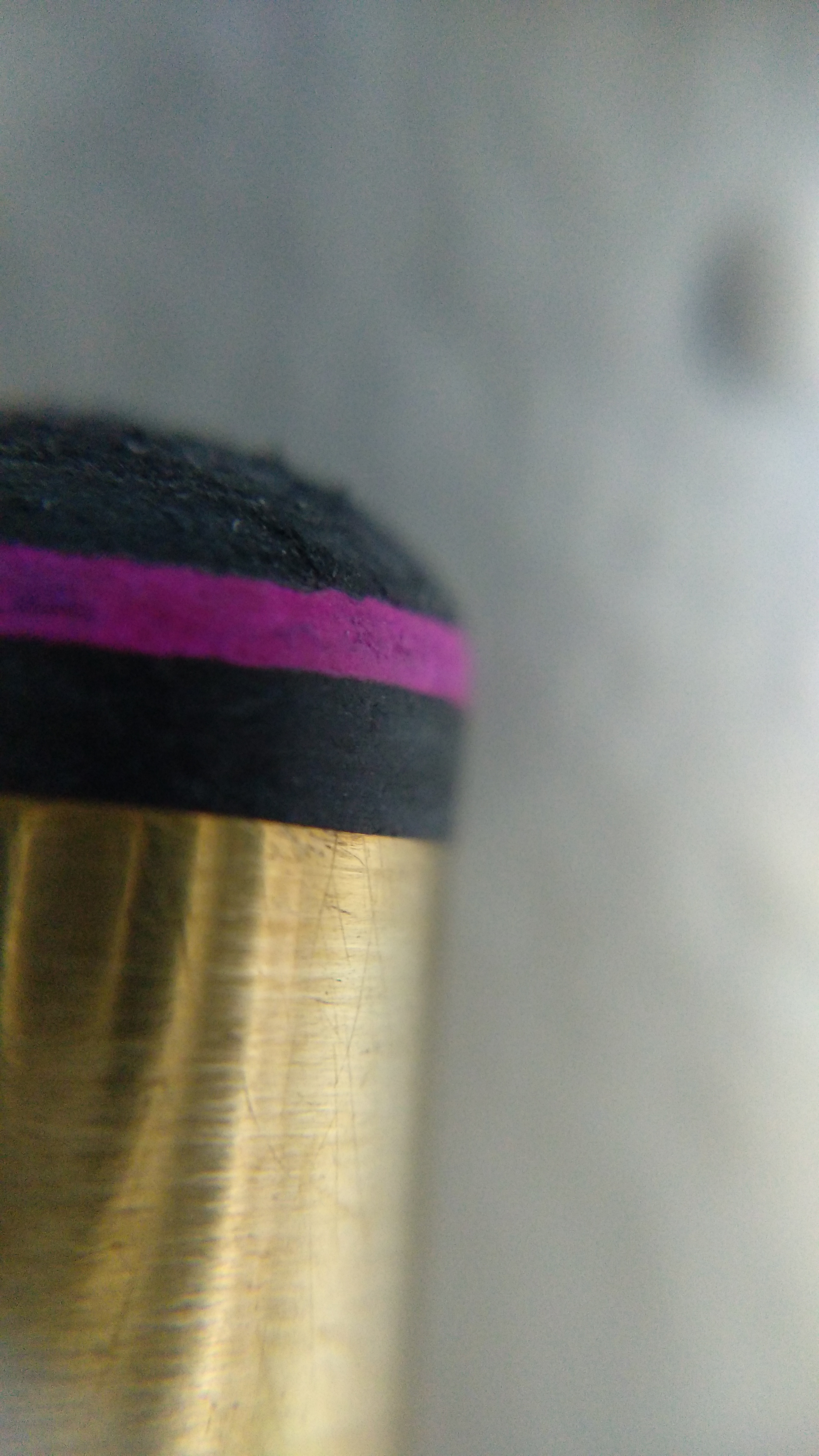 A layered pig skin pool cue tip