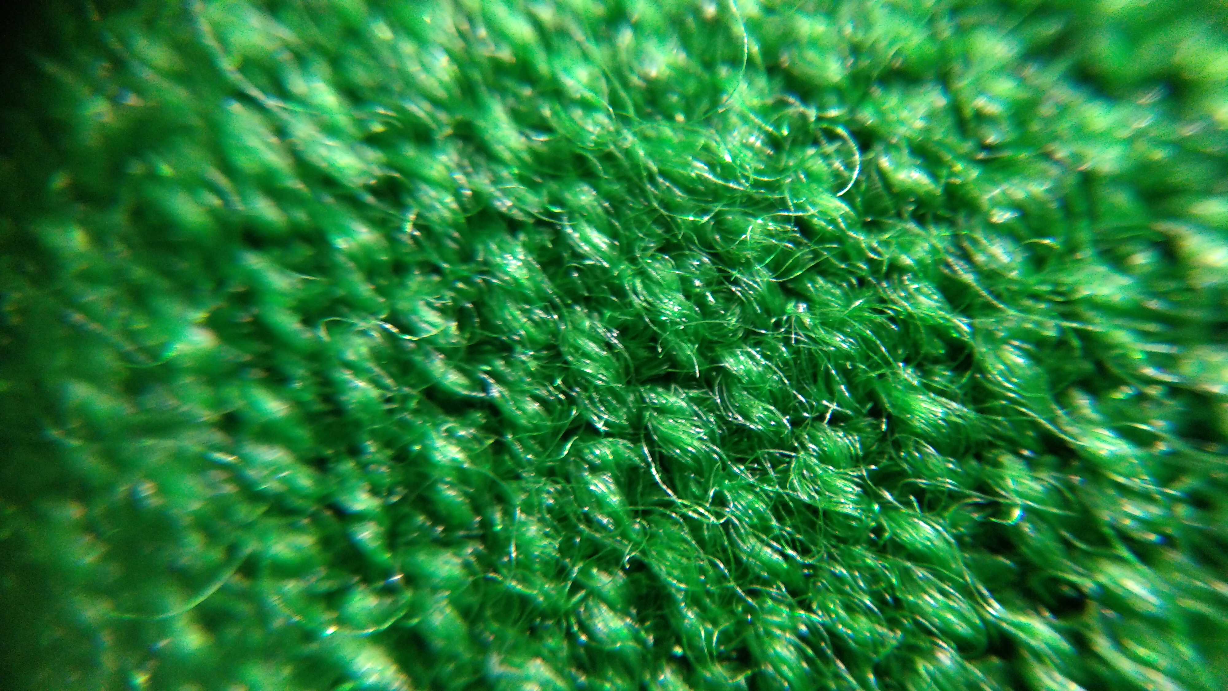 The messy weave of a pool table cloth, macro photograph 