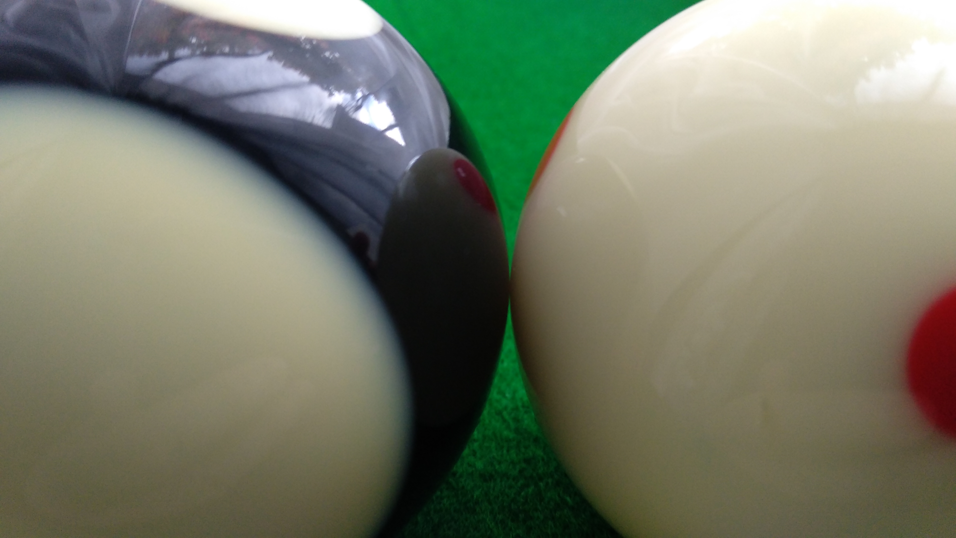 Two pool balls touching